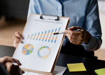 Company meeting room has businessmen and finance managers meeting together on finance topics.