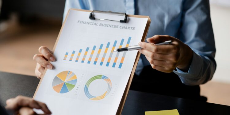 Company meeting room has businessmen and finance managers meeting together on finance topics.